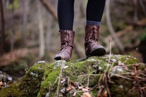 womens boots standing on a rock