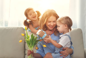 mother with her children and flowers