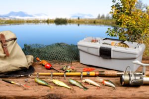 fishing gear shown next to a lake